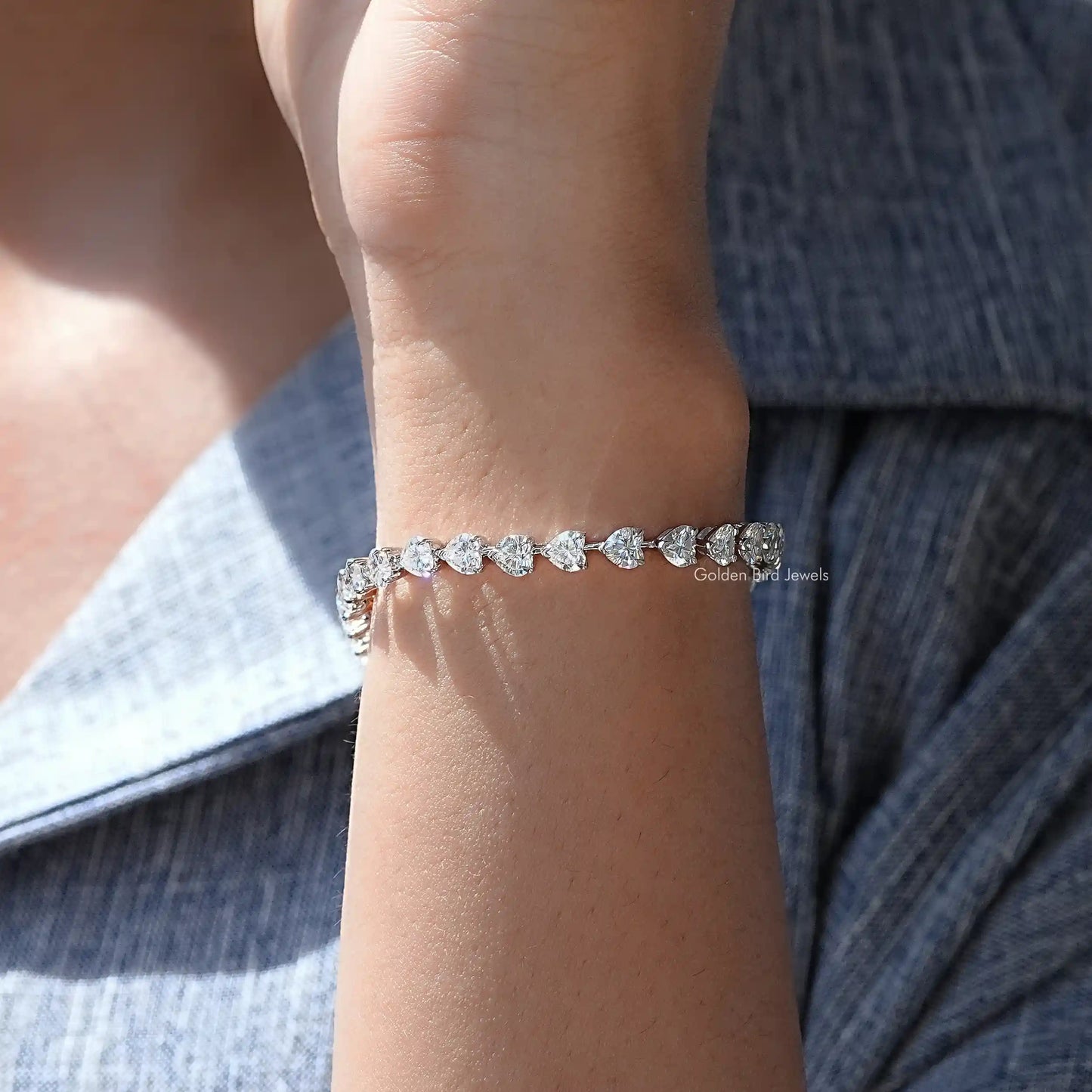 In hand showing view of moissanite bracelet