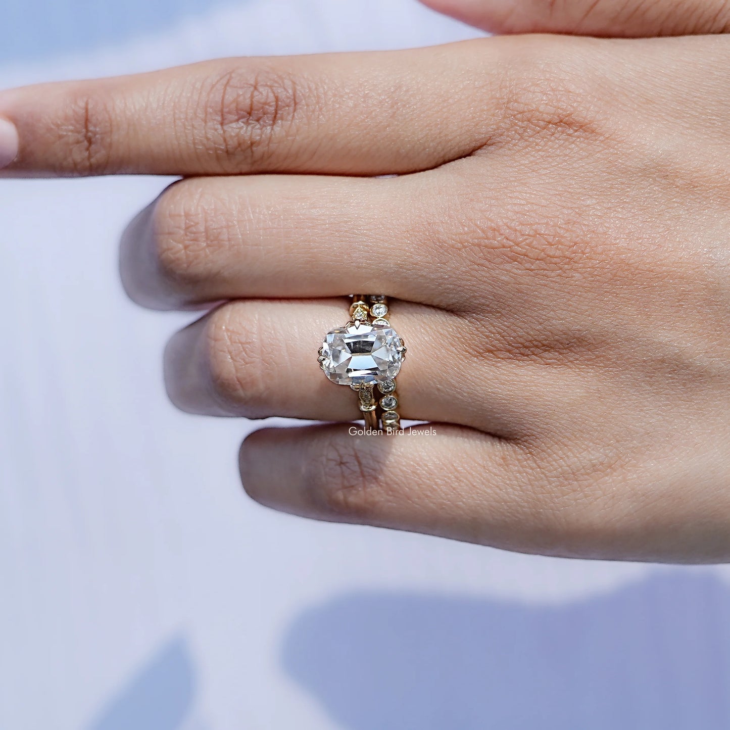 View of solitaire Old Mine Cushion Moissanite ring in prongs setting