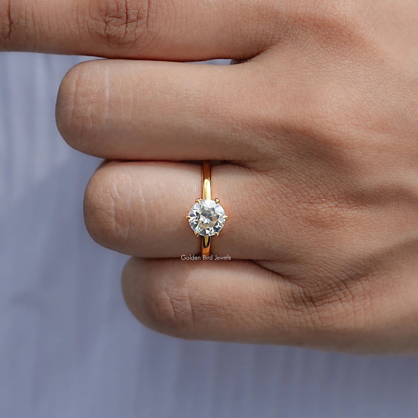 View of Round Cut Moissanite Engagement Ring in prongs setting