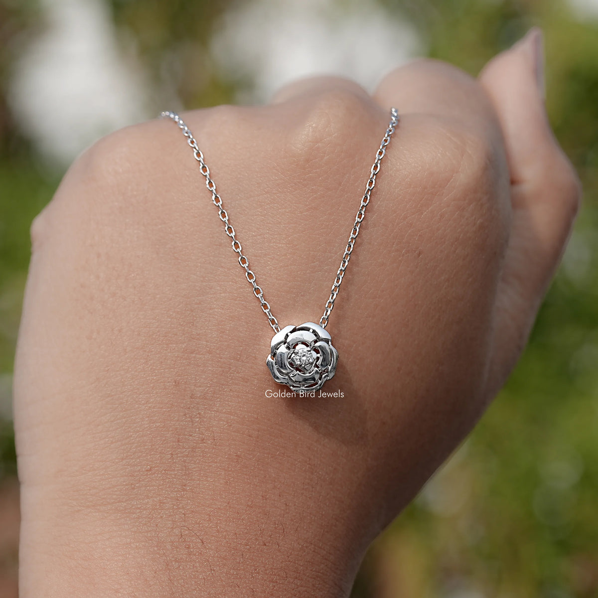 hand Showing View of Lab Diamond Floral Solitaire Pendant