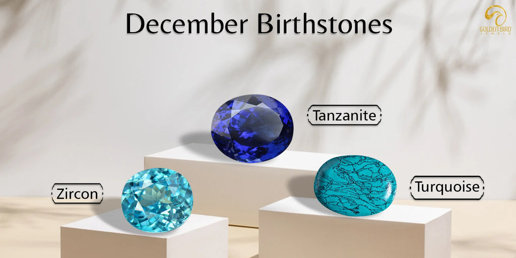 [December birthstones displayed Tanzanite on the top platform, Turquoise on the right, and Zircon on the left. The text 'December Birthstones' is above the stones.]-[Golden Bird Jewels]