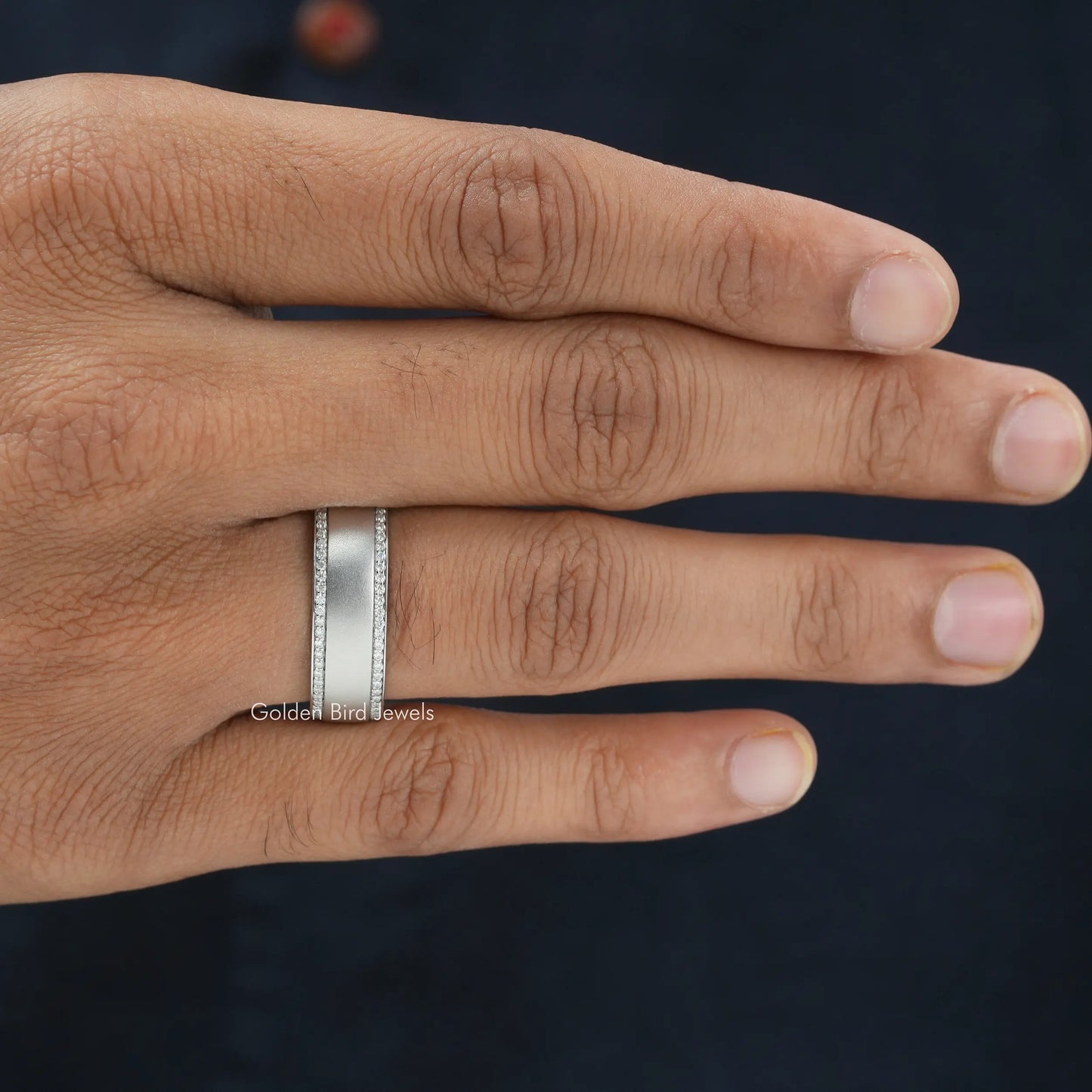 In hand showing view of moissanite Ring	 		