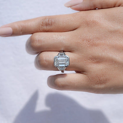 View of Bezel Set Emerald Cut Lab Diamond Halo Ring in prongs setting 