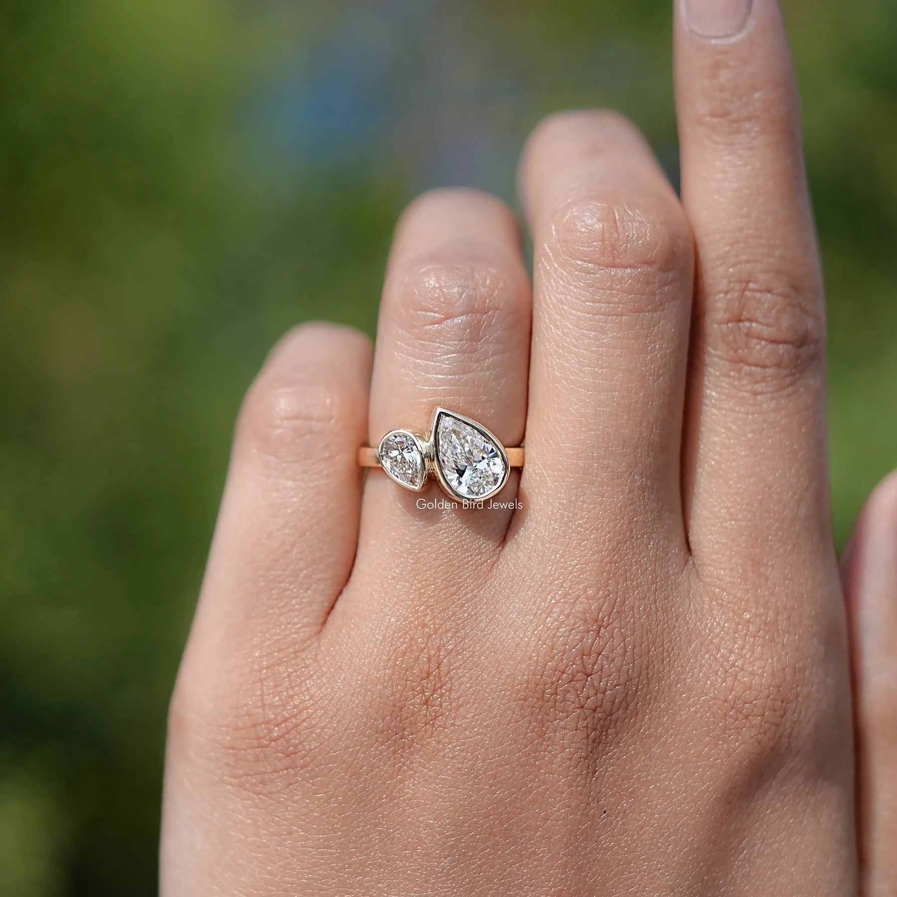 In finger front view of Lab Diamond Toi Et Moi Ring  
