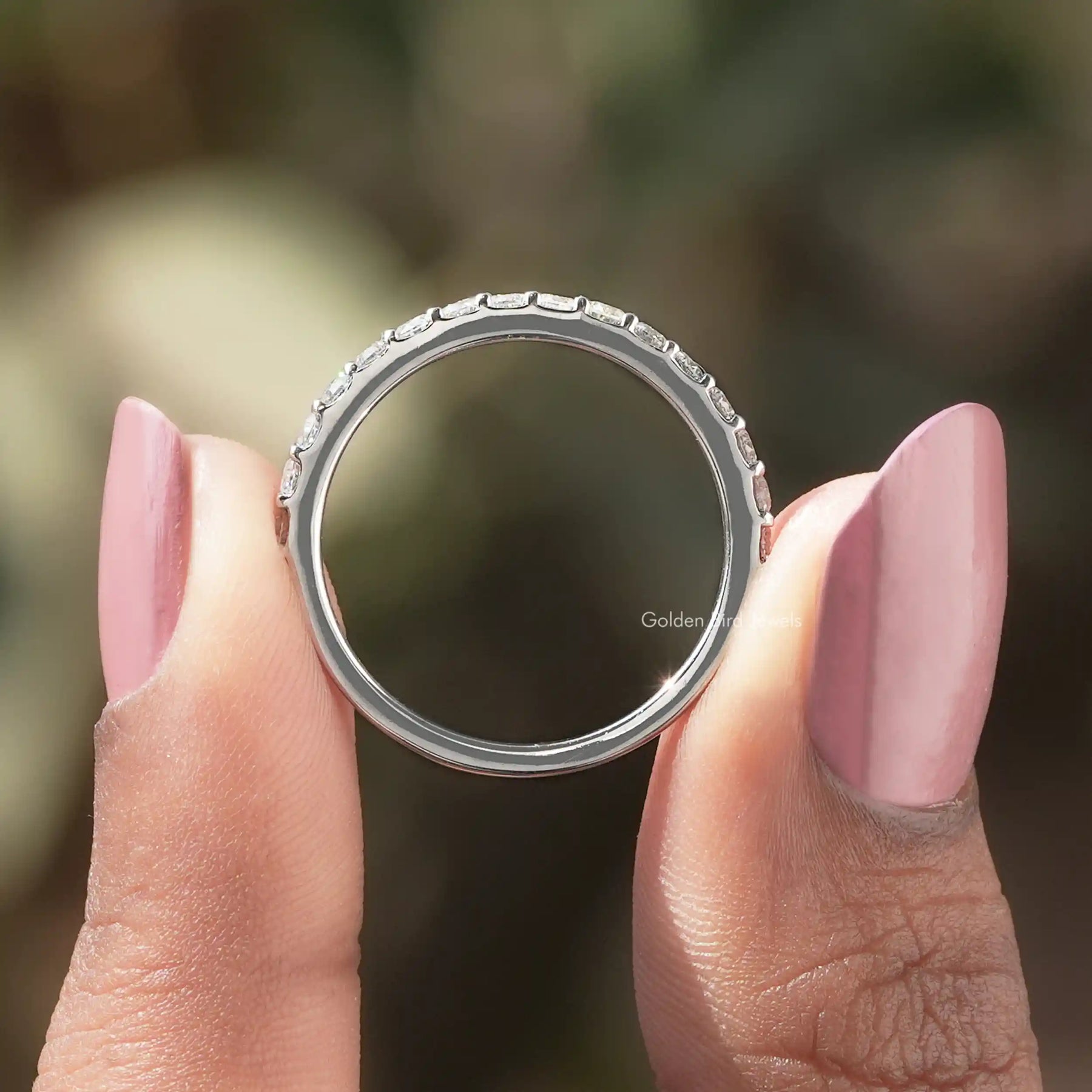 Back view of Round Cut Moissanite Solitaire Ring in secure setting 