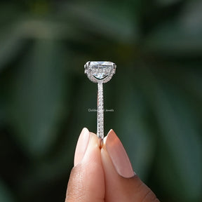 Side View of Moissanite Crushed Ice Cushion Cut Halo Ring In two fingers