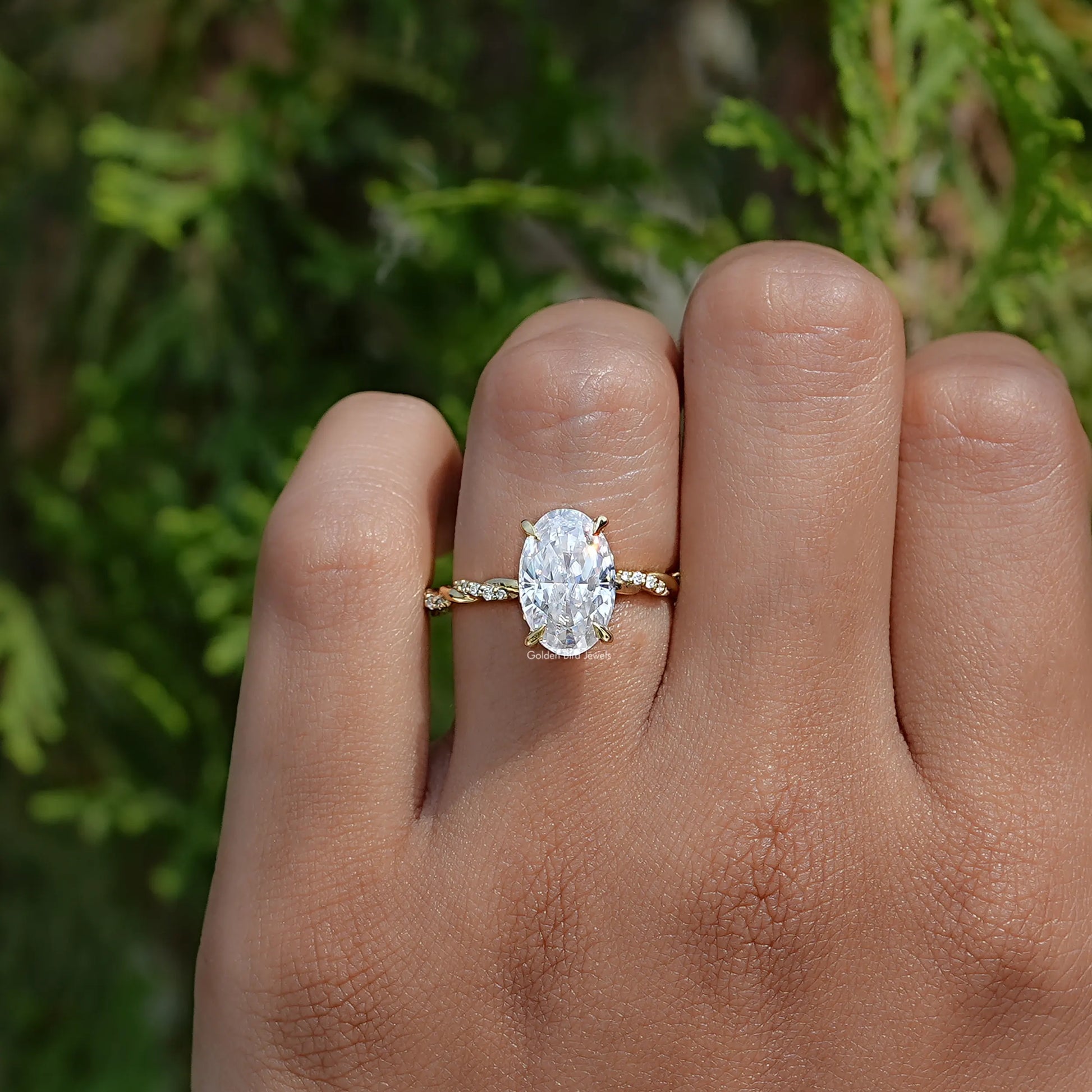 View of Ice Oval Cut  Moissanite Twist Shank Ring In Yellow Gold