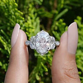 Front View of Ice Oval Cut Moissanite Accent Ring In two Fingers