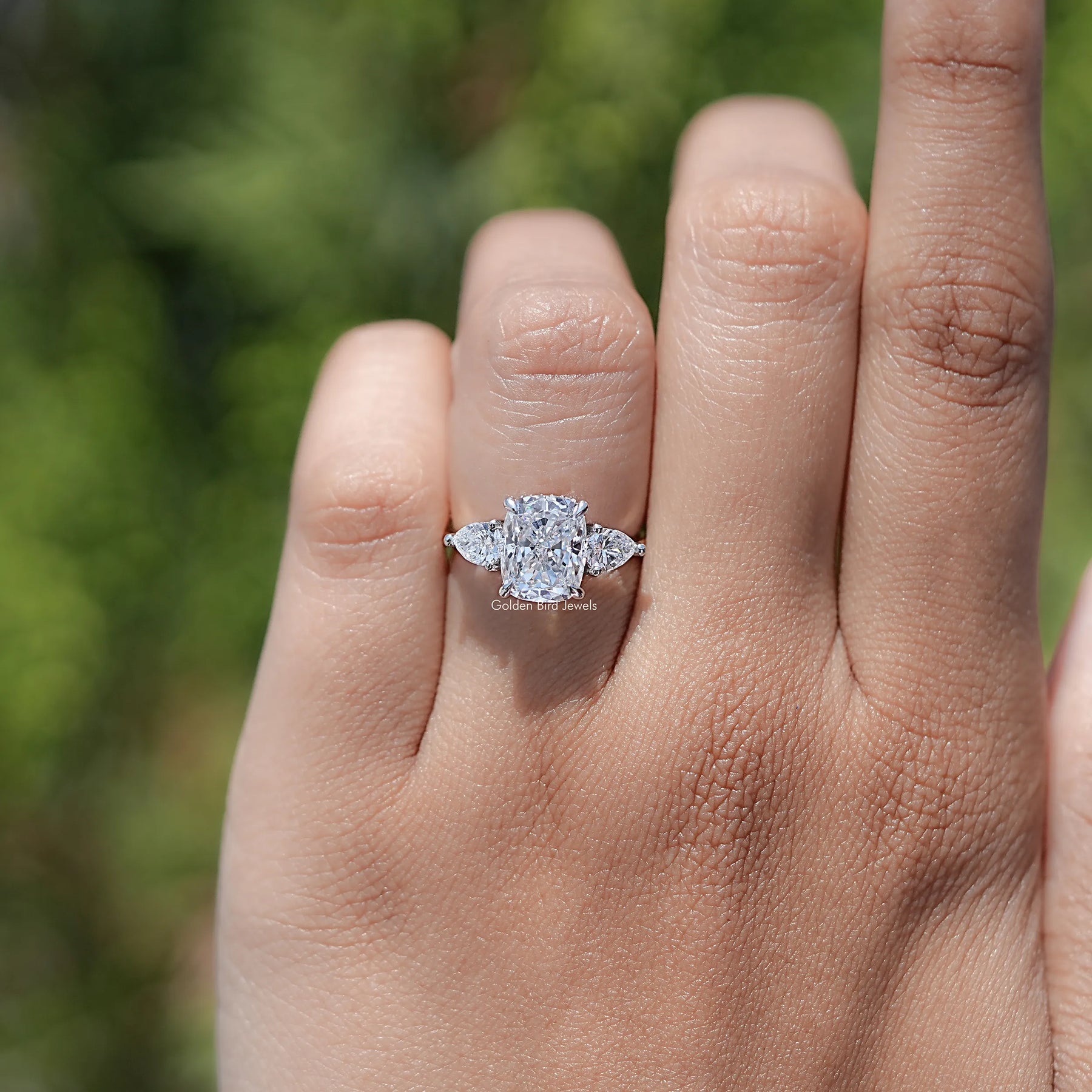 Front view of Cushion Diamond Three Stone Halo Ring