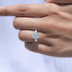 Detailed view of Cushion Diamond Three Stone Halo Ring