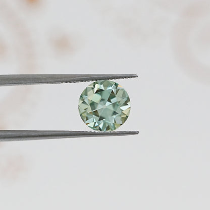 In Tweezer View Of Old European Round Cut Loose Moissanite