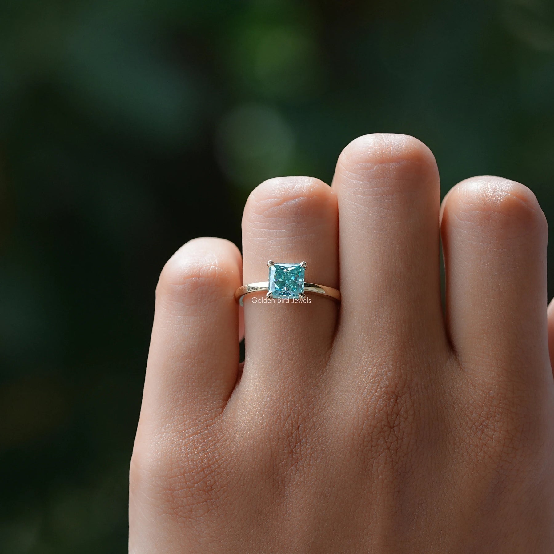 Close-Up View of Blue Princess Cut Moissanite Ring In White Gold