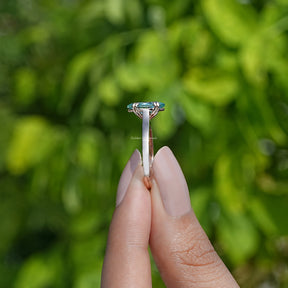 Side View of Marquise Cut Moissanite Solitaire Ring In two fingers