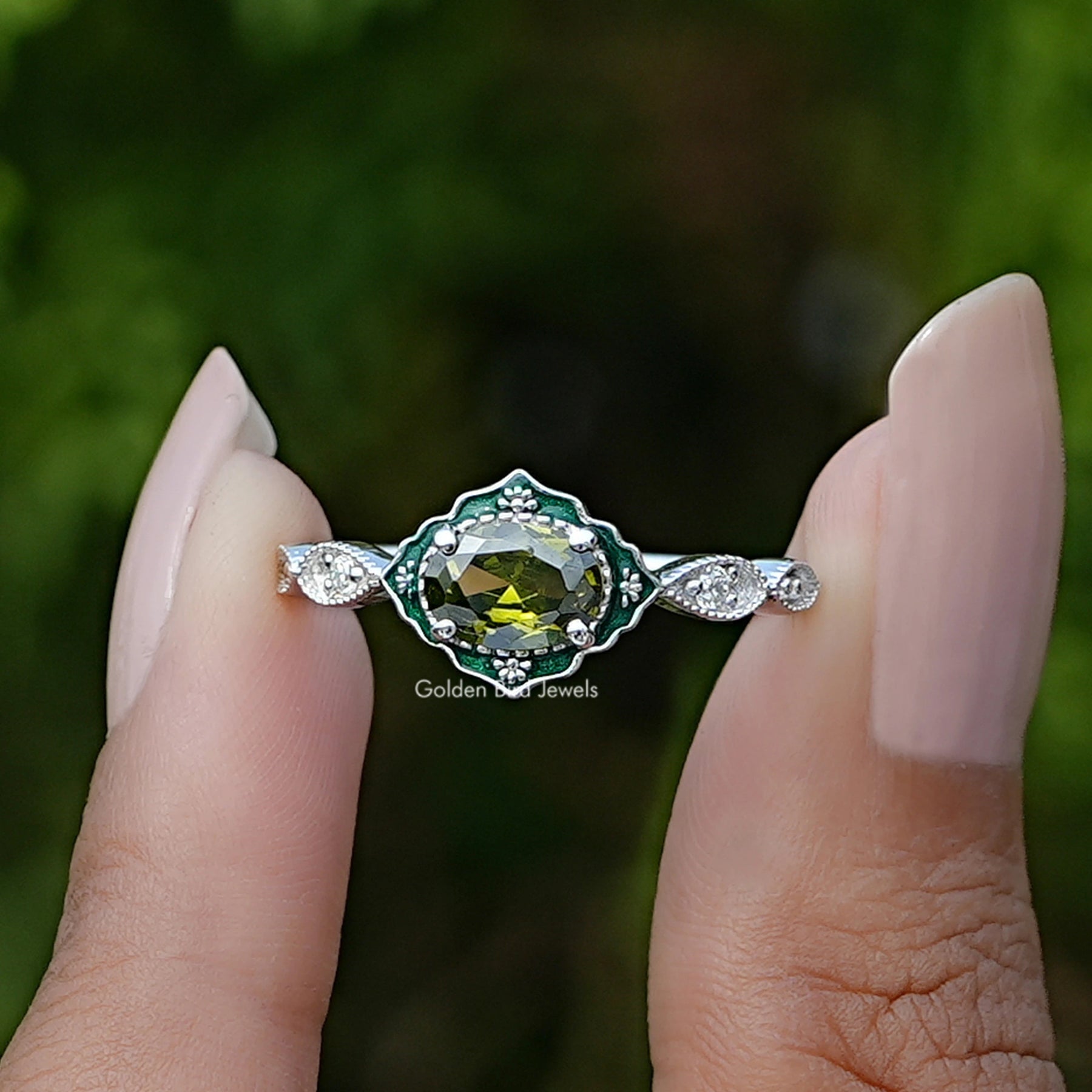 Front View of East West Oval  Cut Gemstone Engagement Ring In two Fingers