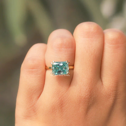View of East West Radiant Cut Moissanite Ring In Yellow Gold