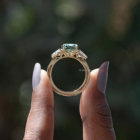 Back View of Cushion And Trillion Cut Moissanite Ring In two fingers