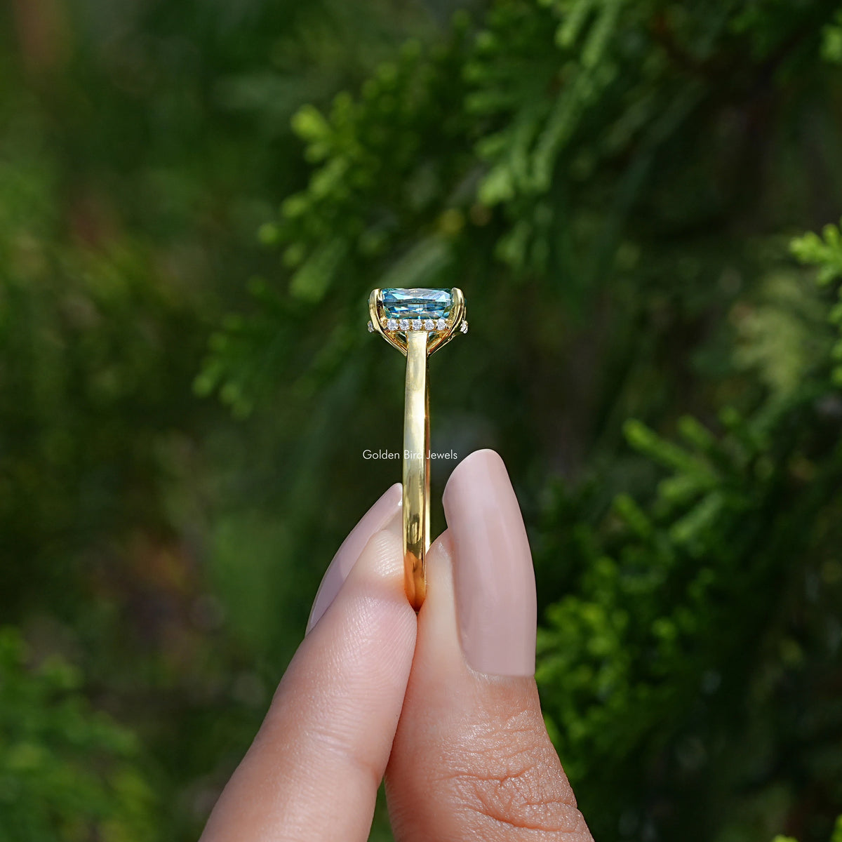 Side View of Elongated Cushion Cut Moissanite Ring In two fingers