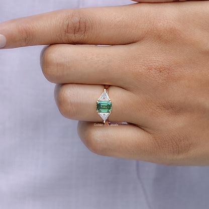 View of solitaire Emerald And Triangle Moissanite Three Stone Ring in prongs setting 