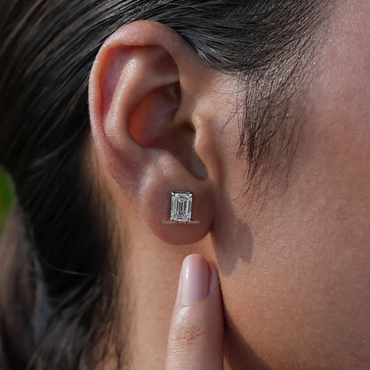 Emerald cut diamond stud earrings in white gold 