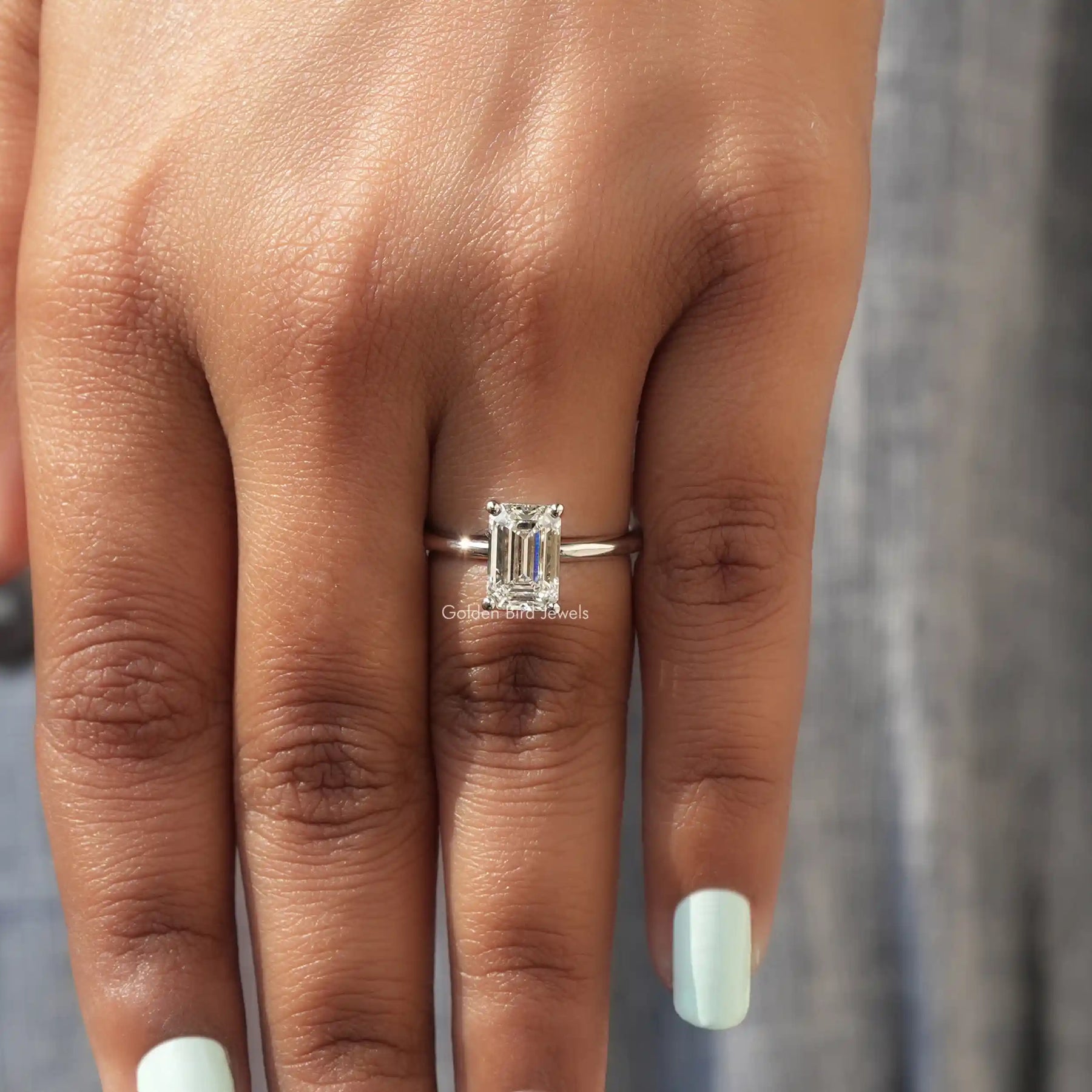 View of Emerald Cut Diamond Solitaire Engagement Ring In White Gold