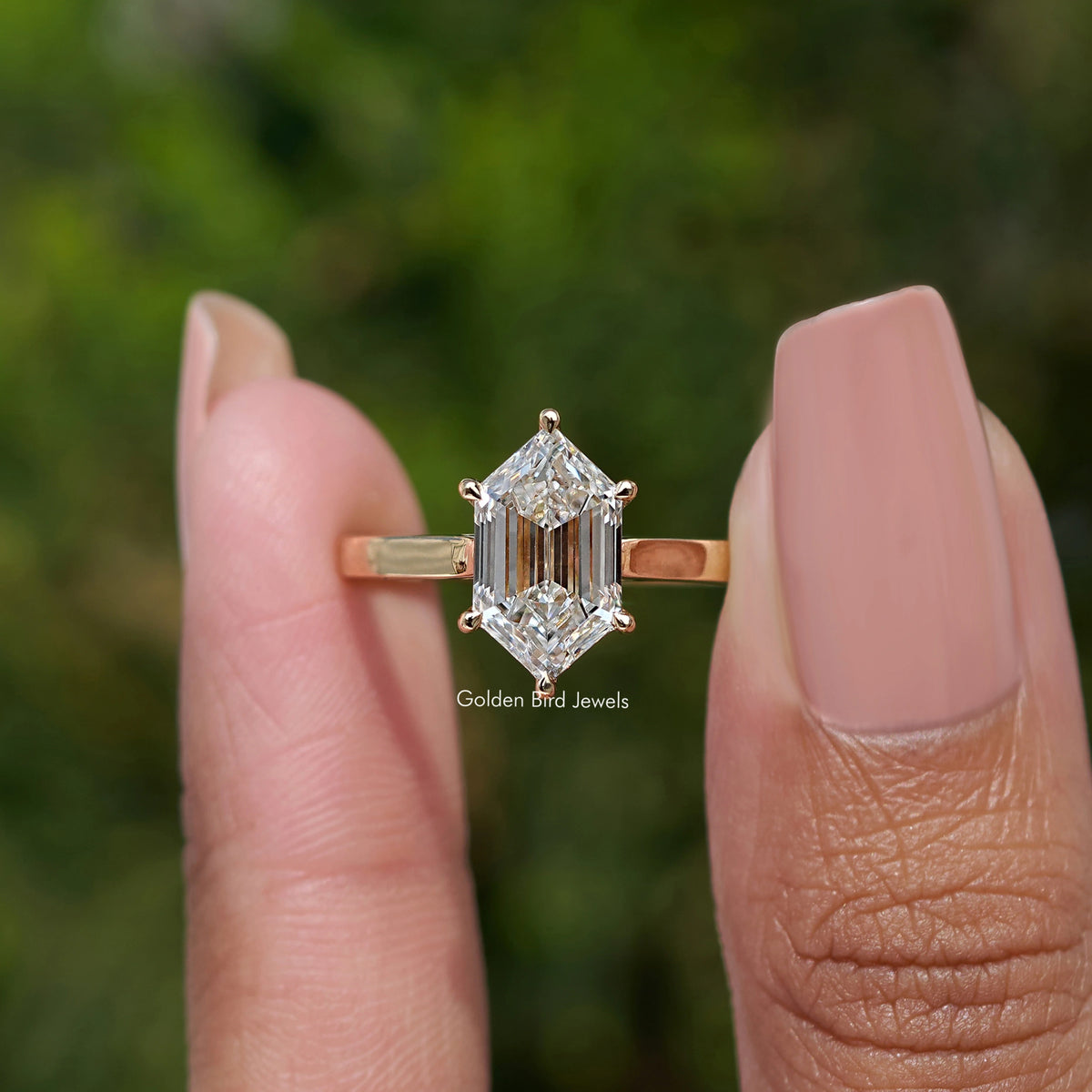 Step Cut Dutch Marquise Lab Diamond Ring held between fingers 
