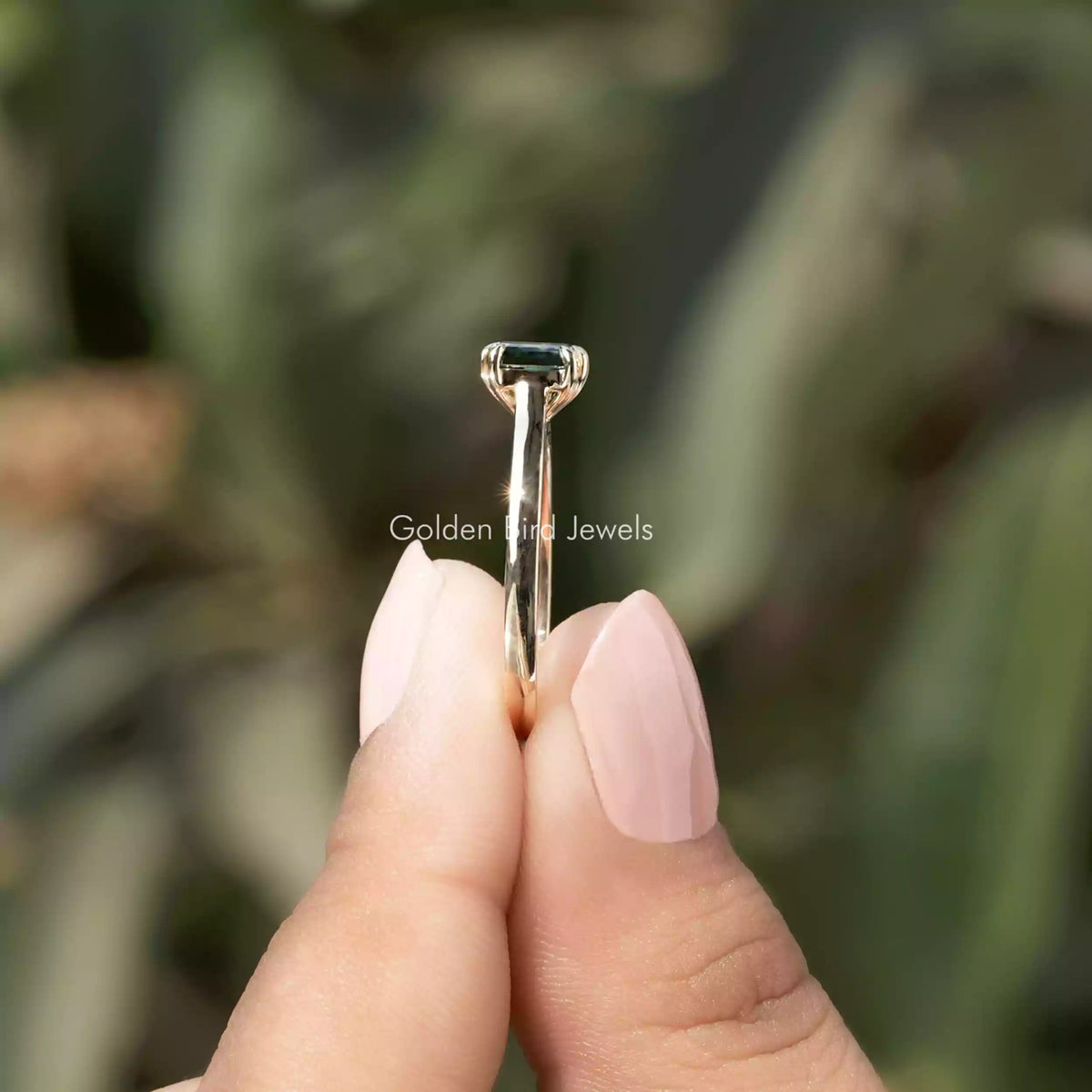 Side View of Asscher Cut Moissanite Ring In two fingers