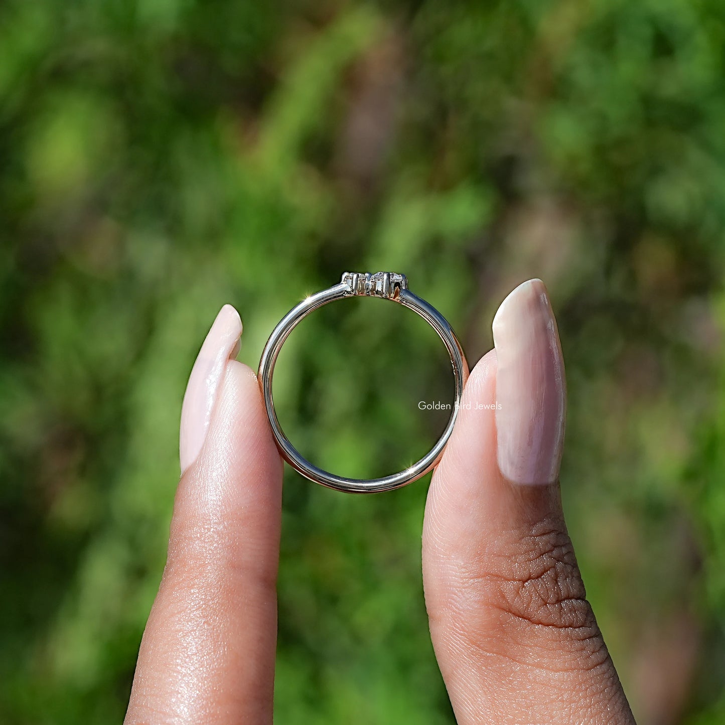 Back View of Round Cut Diamond Solitaire Toi Et Moi Ring In two fingers