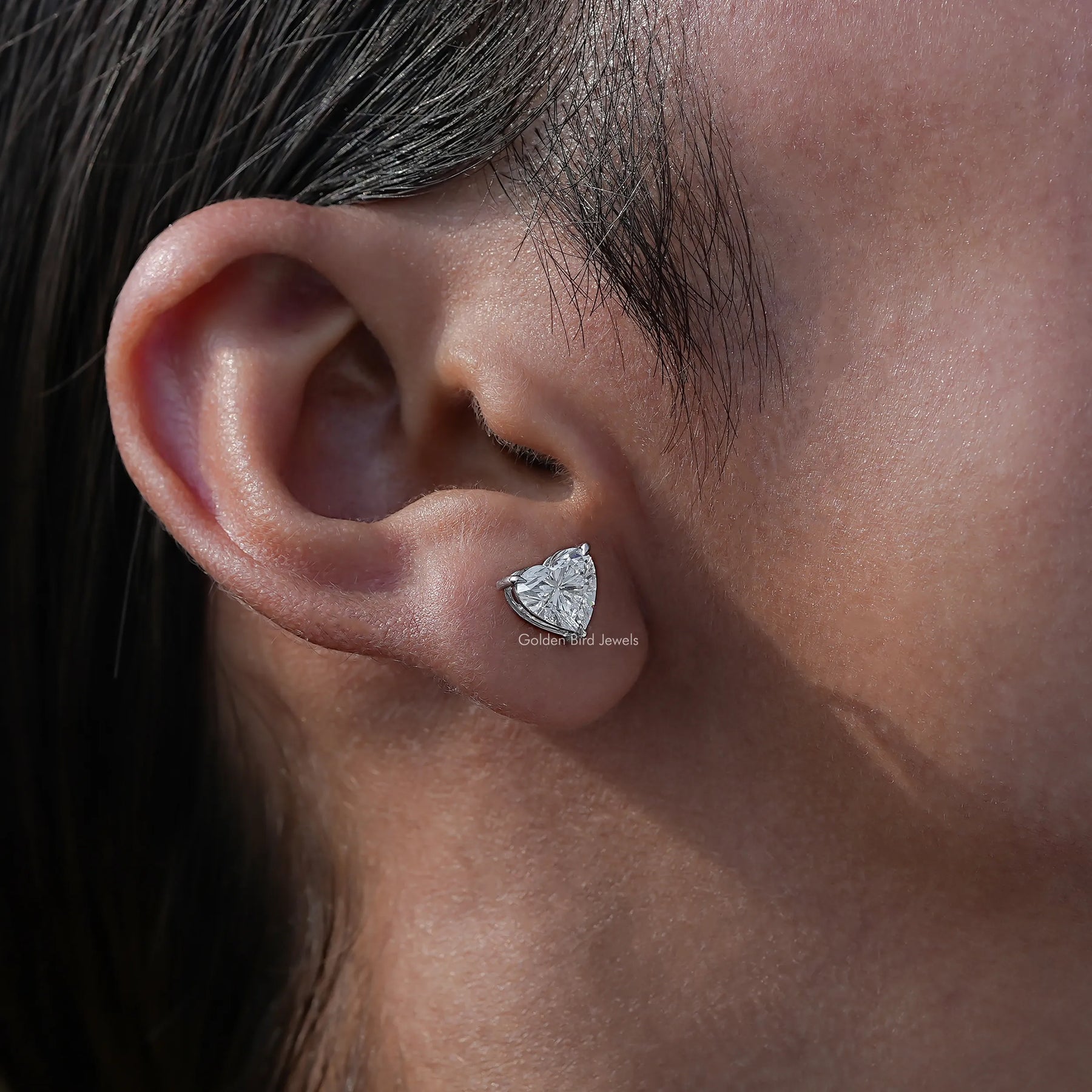 Heart shaped solitaire diamond stud earings in white stone 