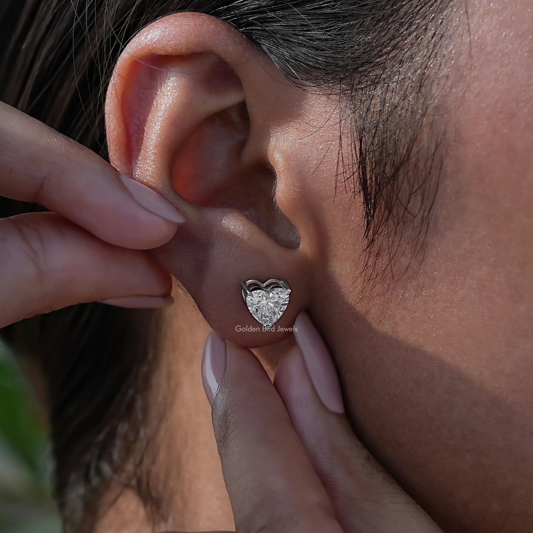 Side view of diamond solitaire stud earrings for any occasion 