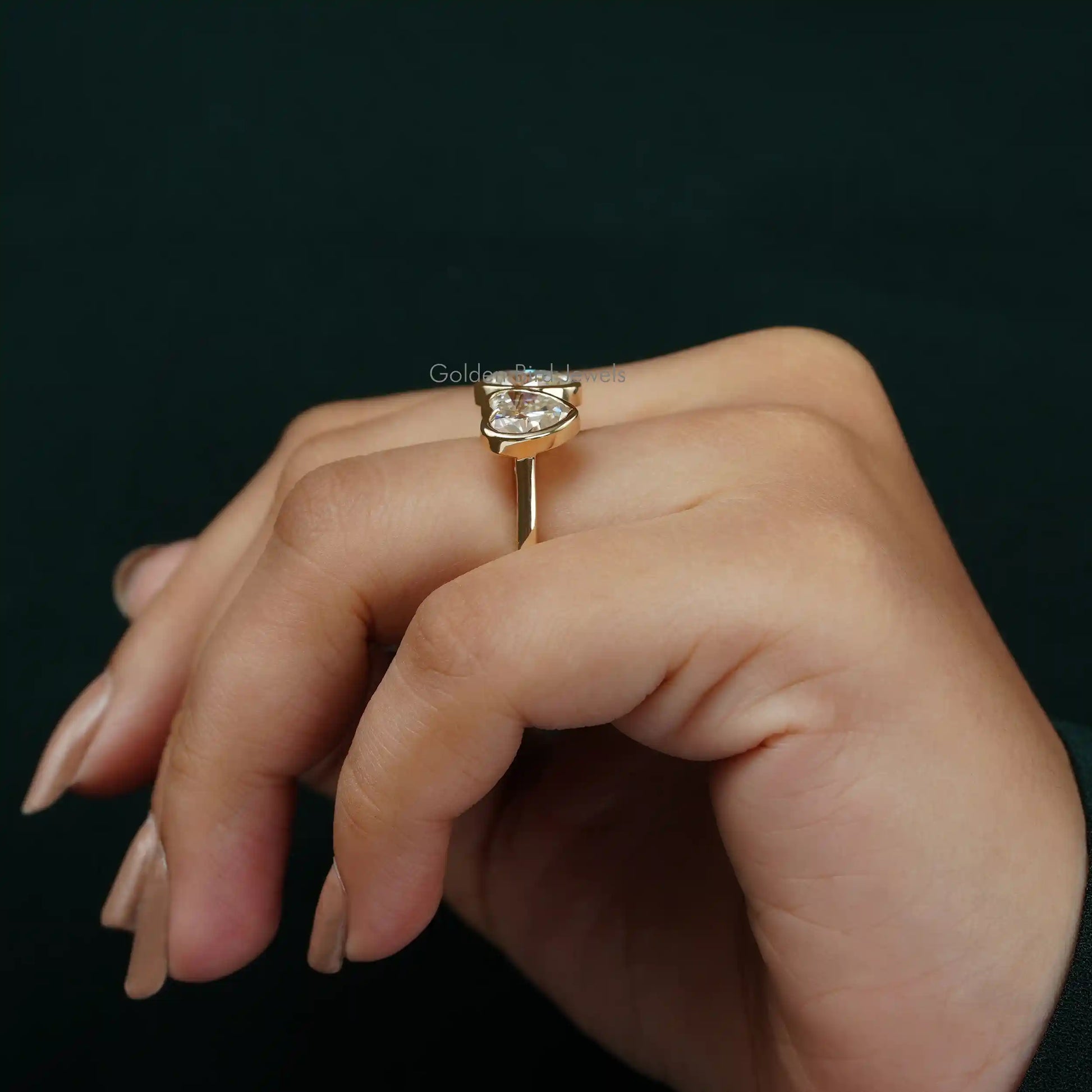 View of Toi Et Moi Oval And Heart Cut Moissanite Wedding Ring In Finger