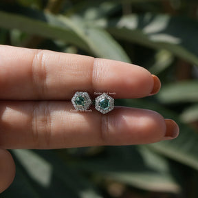 In  two-finger view of halo moissanite stud earings 