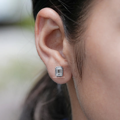 In Ear View of Emerald Cut Lab Diamond Bezel Set Stud Earrings