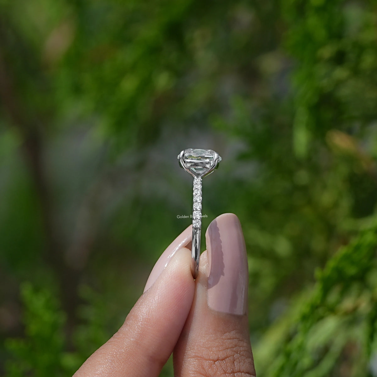 old mine cushion Accent stone Ring holding on two fingers 