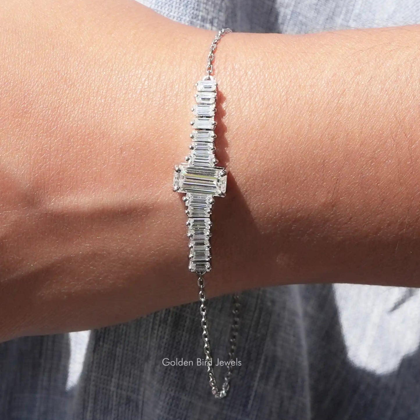View of moissanite emerald cut with baguette tennis Bracelet