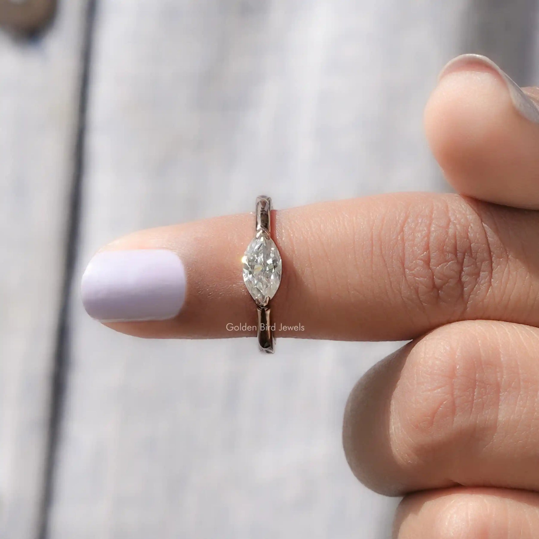 In finger front View of Marquise Cut Moissanite Engagement Ring