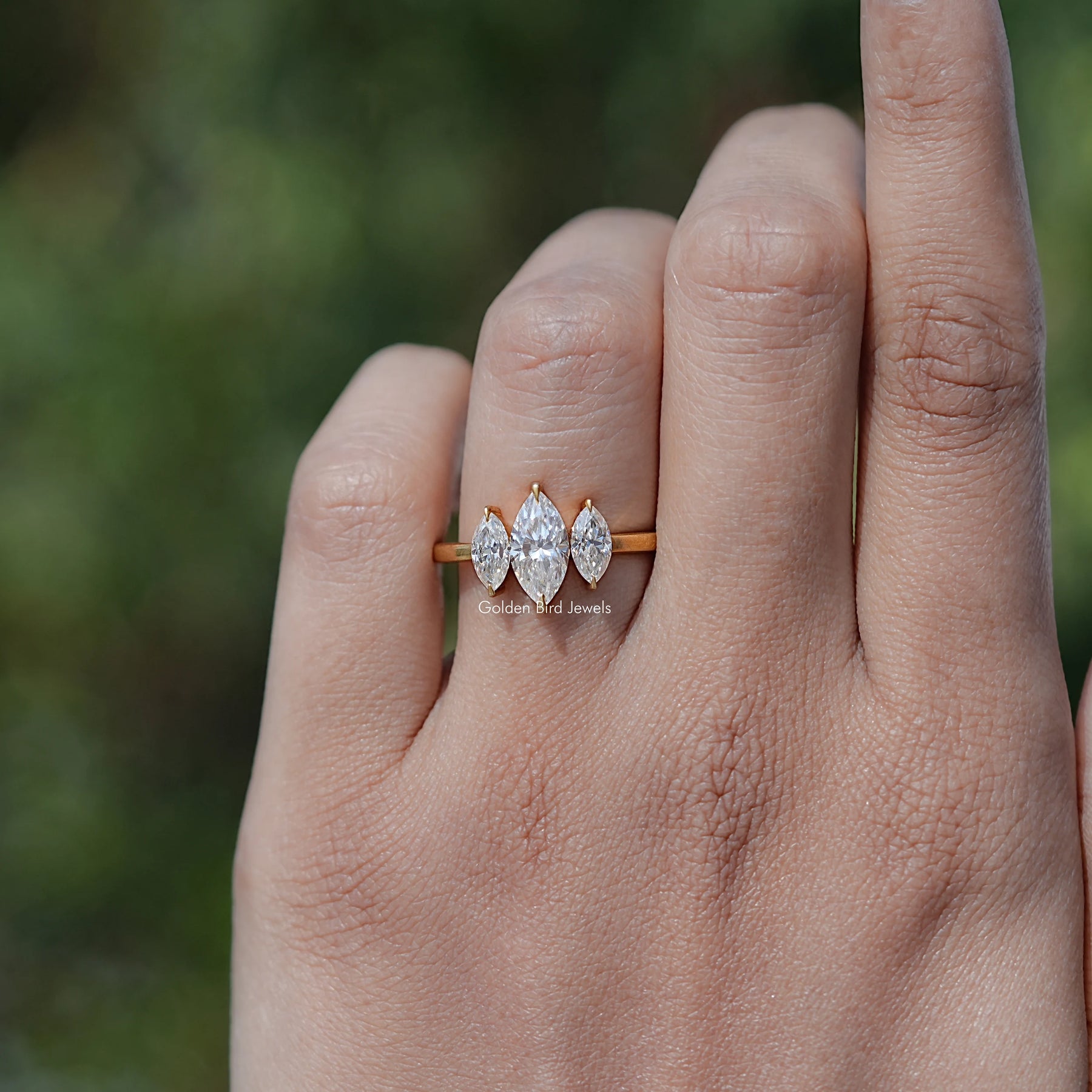 In finger view of Marquise Shaped Solitaire Moissanite Ring