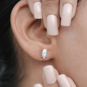 In Hand View Of Marquise Shaped Moissanite Stud Earrings