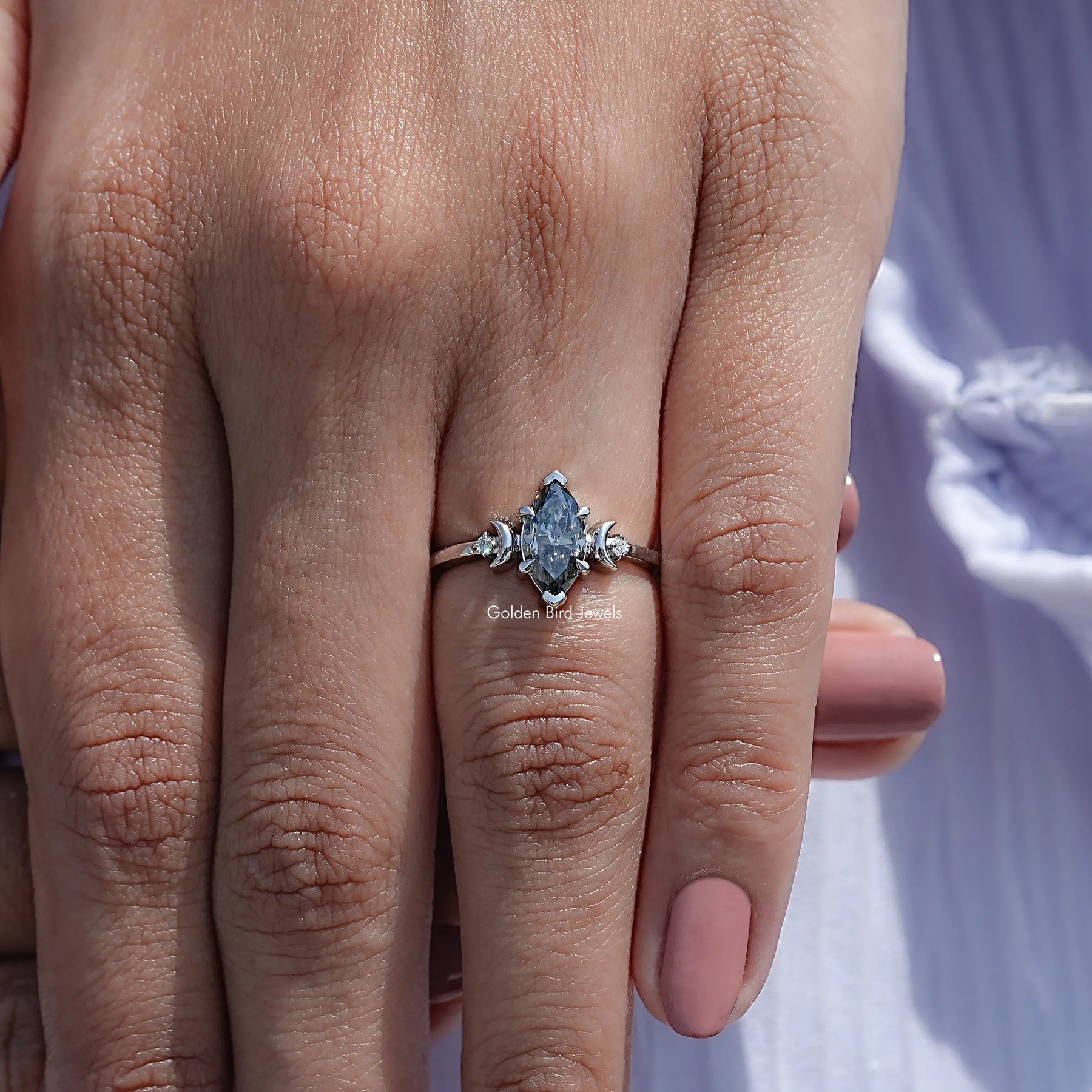 Detailed View Of Three Stone Marquise Engagement Ring