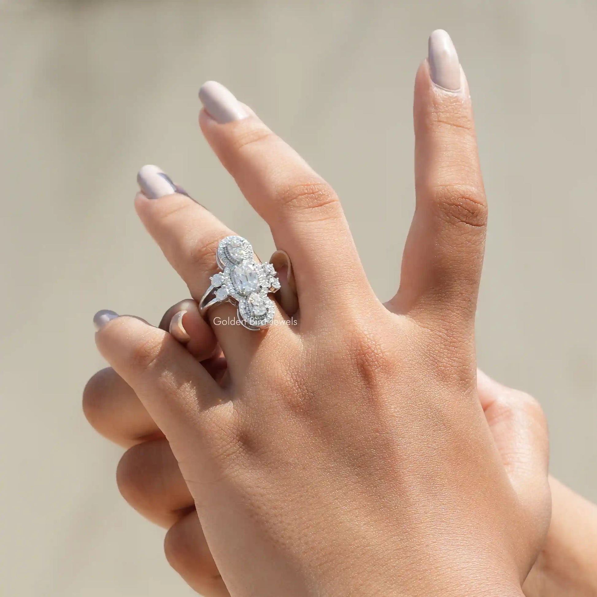 View of Old Mine Cushion And Pear Cut Moissanite Engagement Ring In Finger