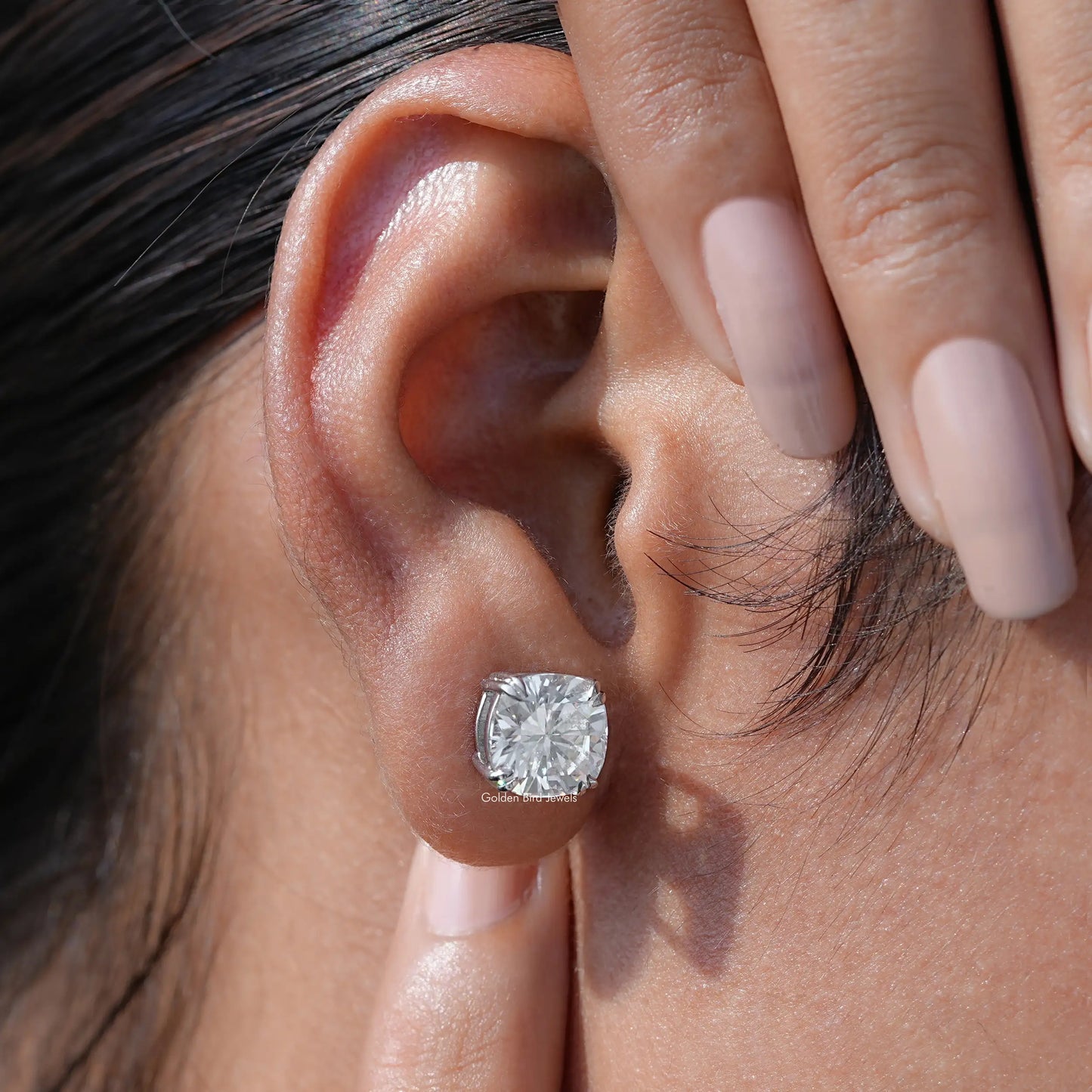 Detailed view of moissanite earrings in secure setting