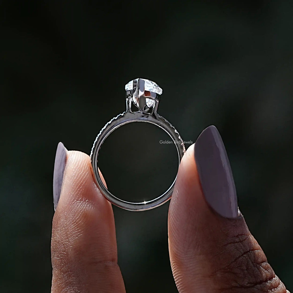 Back View of Marquise Cut Moissanite Ring In two fingers