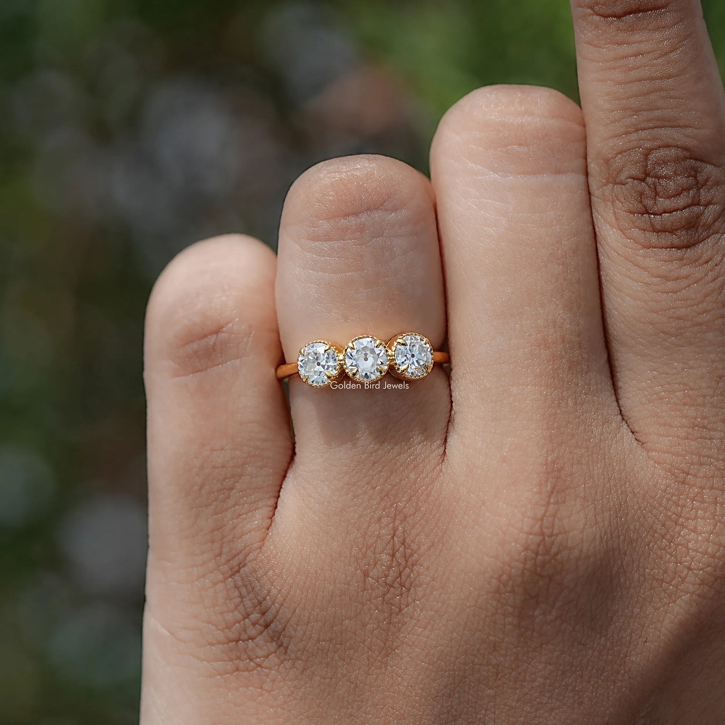 In finger view of European Cut Moissanite Solitaire Ring