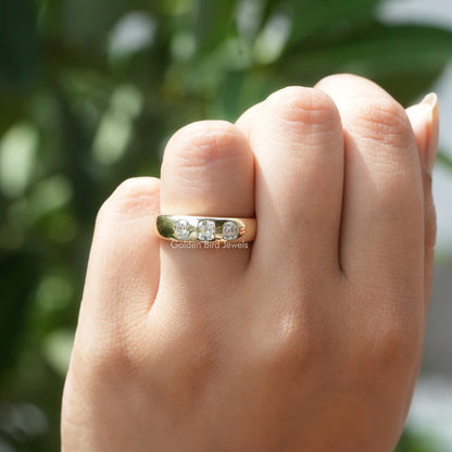 In hand showing a view of moissanite Ring	 		