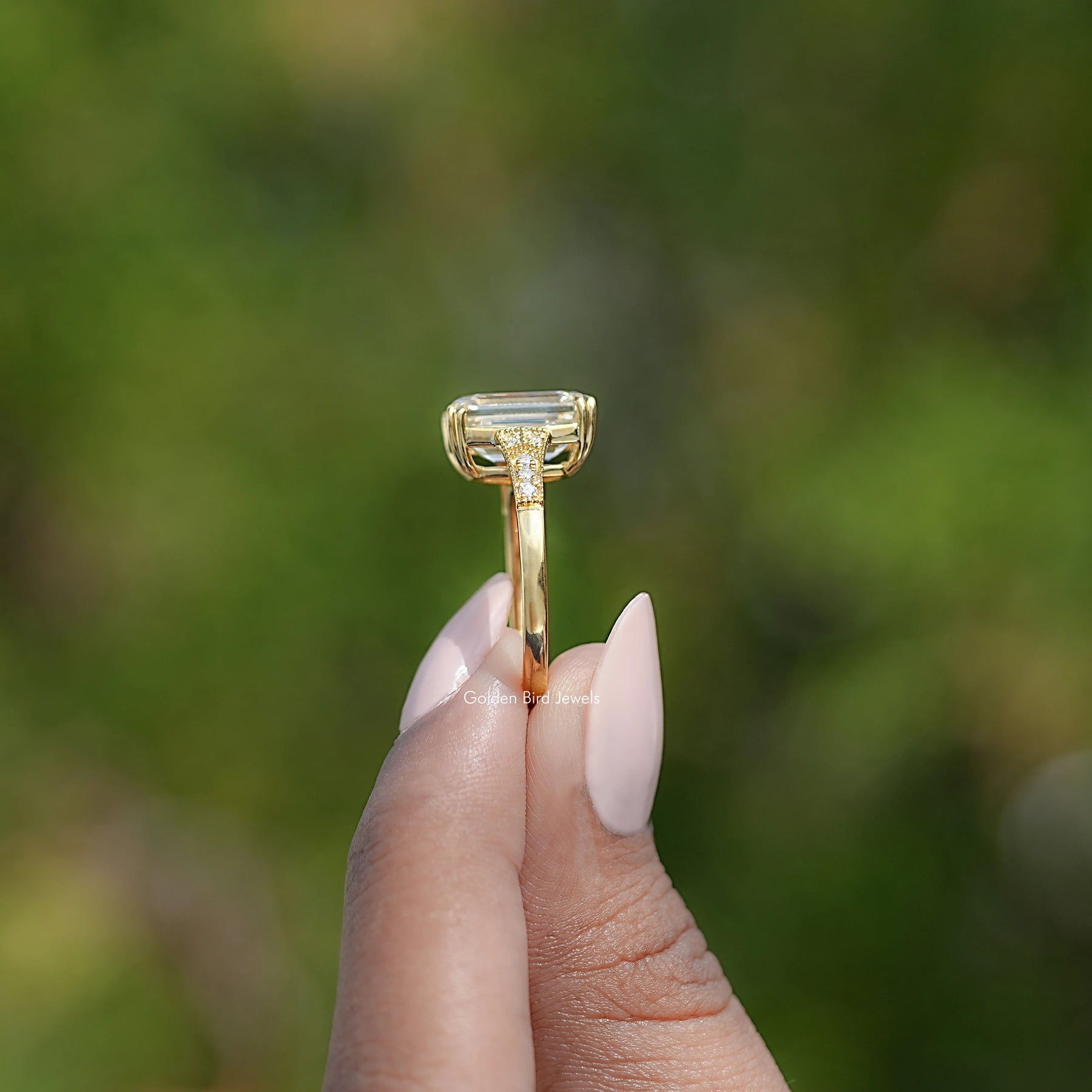 Side View Of Emerald Cut Accent Stone Ring
