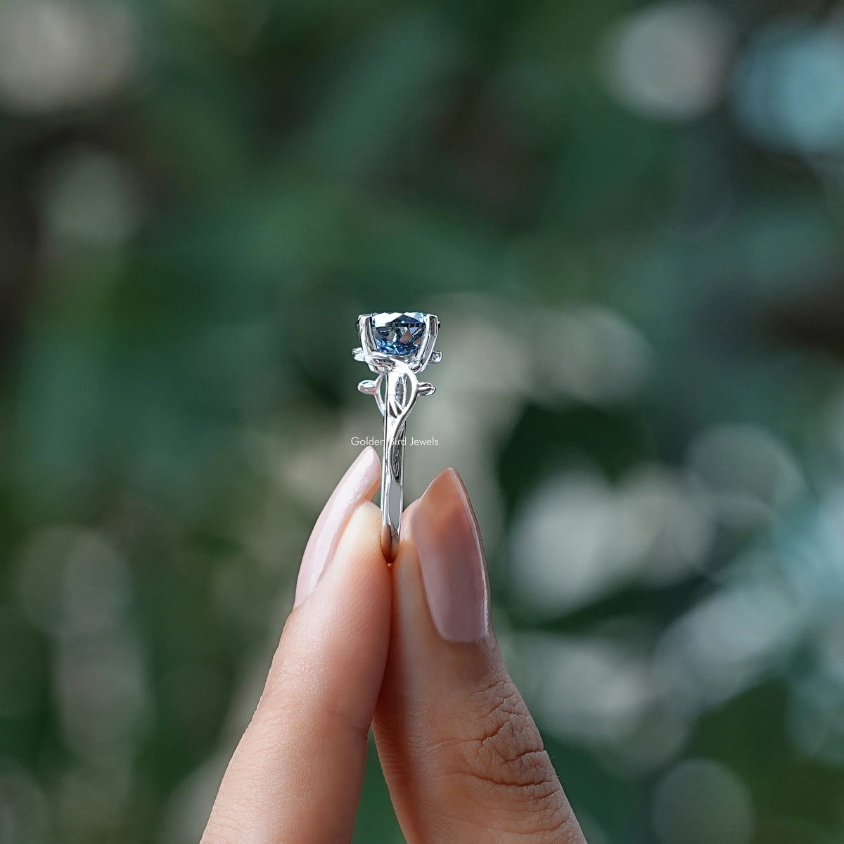 Side View of Portuguese Cut Moissanite Ring In two fingers