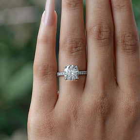 Close-Up View of Round Shape Solitaire Ring With Accent Stones In White Gold