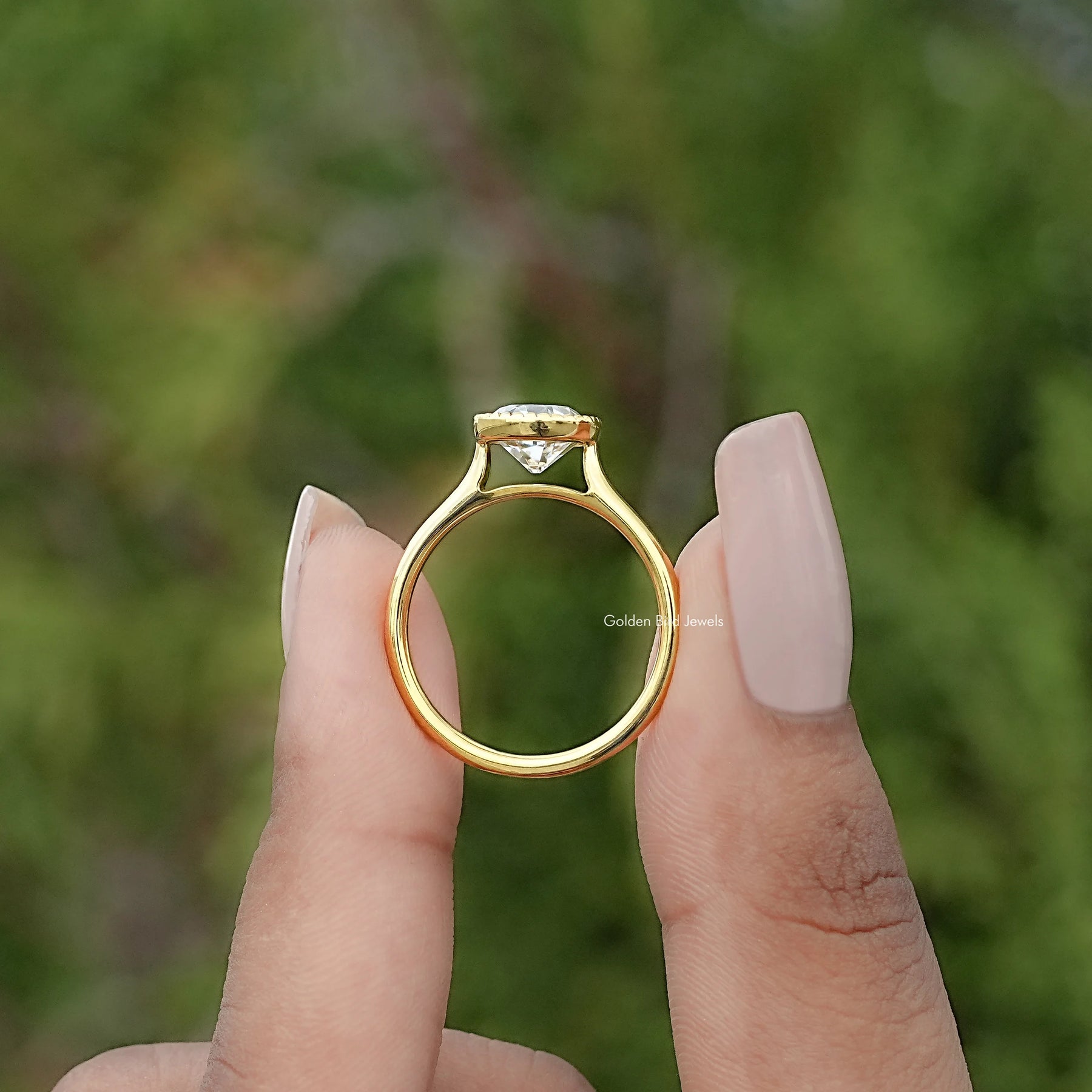 Back view of Round Cut Solitaire Engagement Ring in secure setting