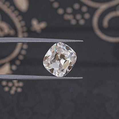 In Tweezer View Of Old Mine Cushion Cut Loose Moissanite Stone