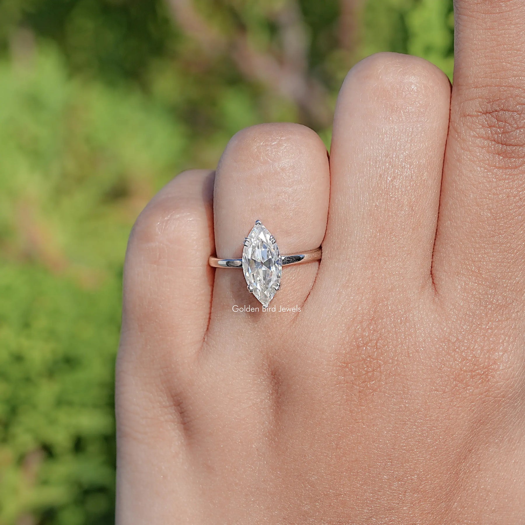 Top View Of Near Colorless Old Mine Marquise Moissanite Ring