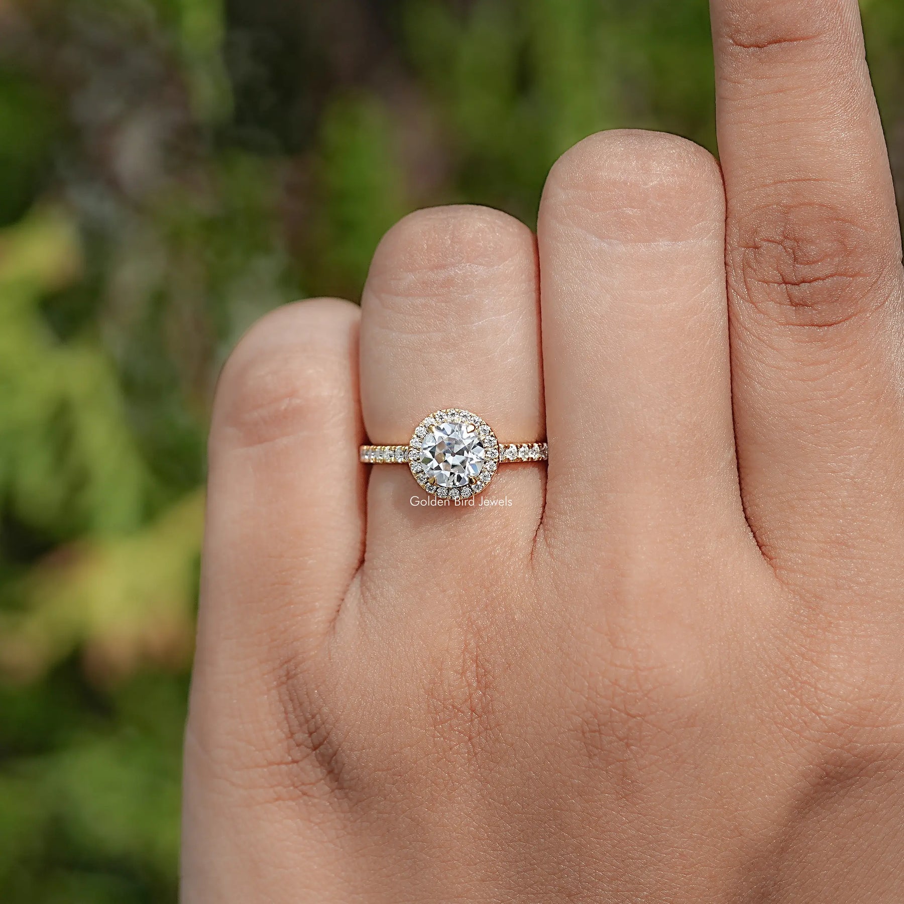 In finger view of Round Cut Moissanite Engagement Ring 